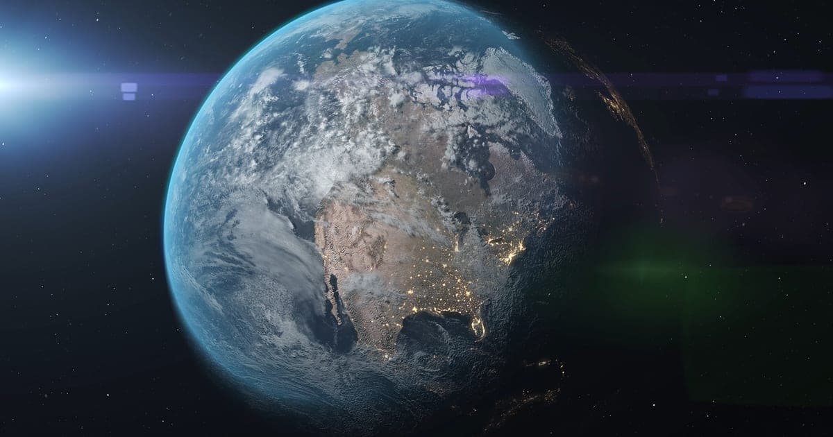 Earth seen from space at night, with North America's city lights visible.